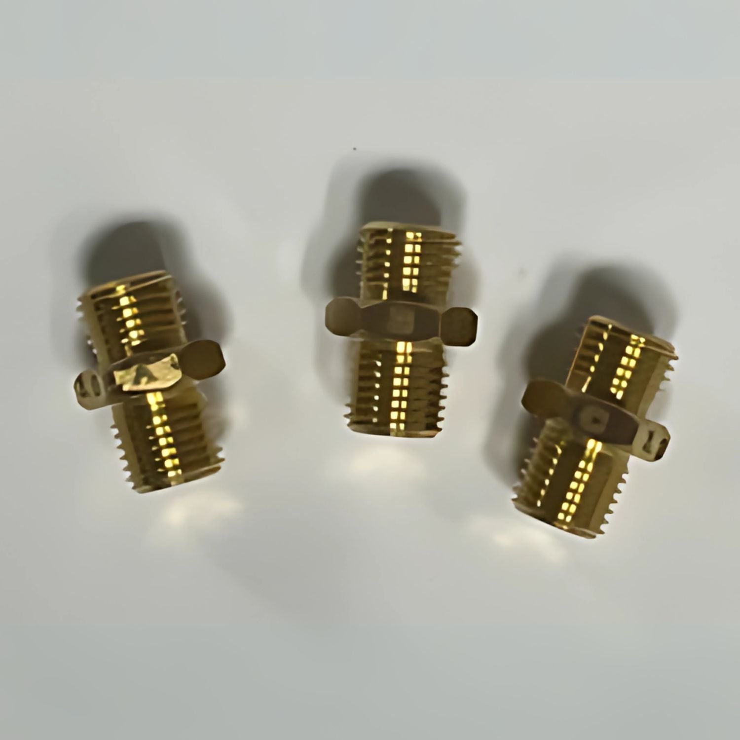 Cummins High Altitude Regulator Kit, P4500iDF Three brass plumbing connectors on a white background