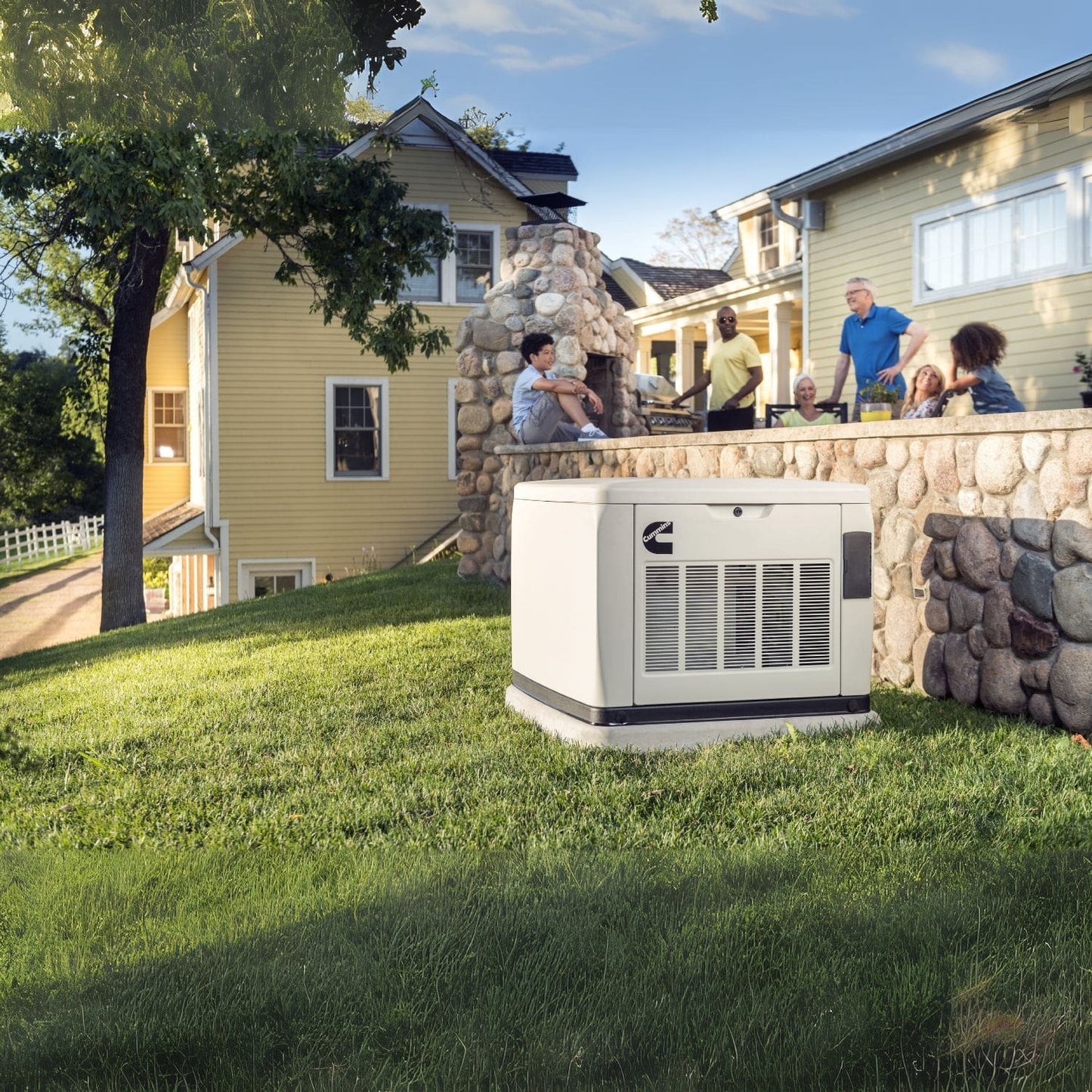 Cummins RS13A 13kW Home Standby Generator outside the yard with six people nearby