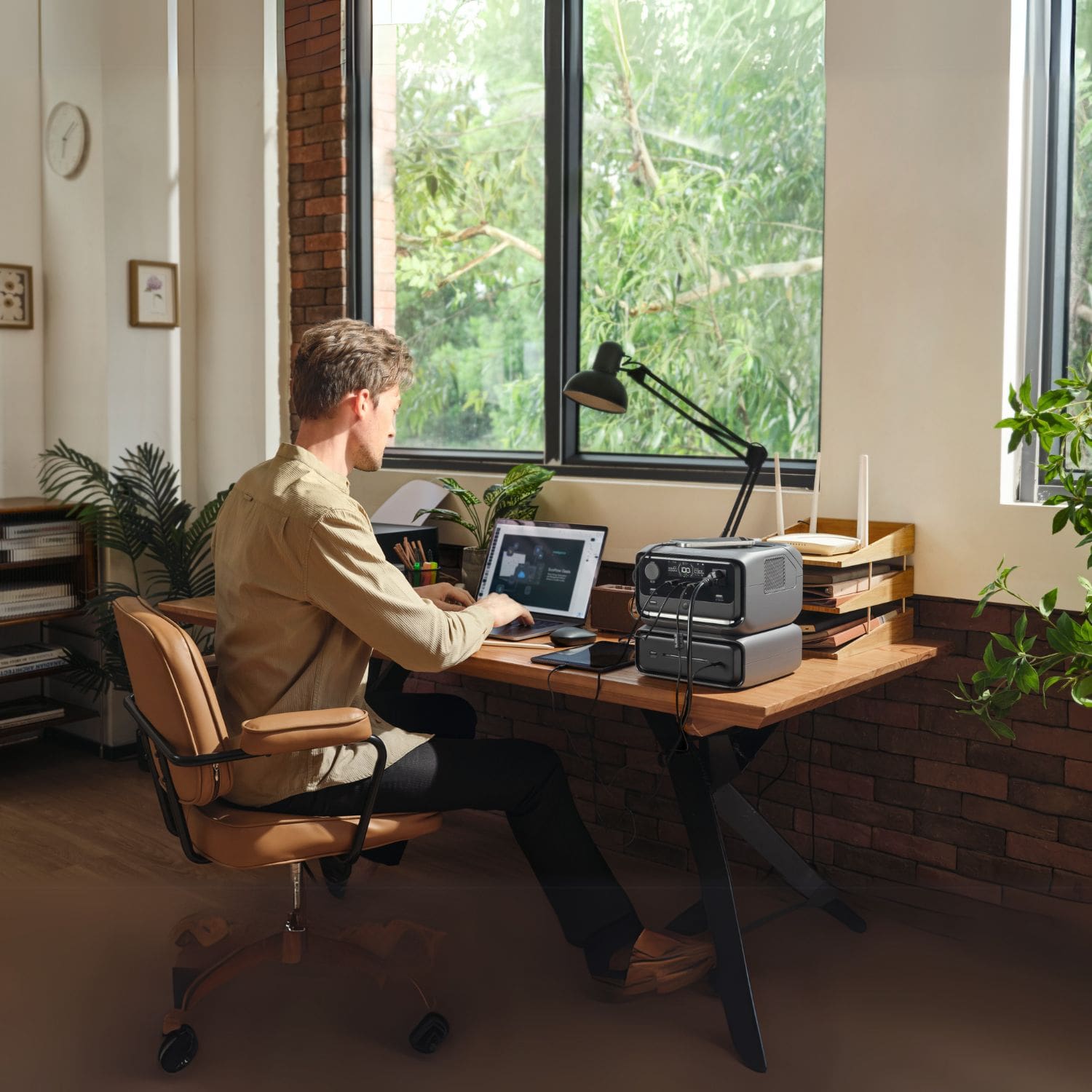 EcoFlow RIVER 3 Max Portable Power Station beside a man with ipad charging