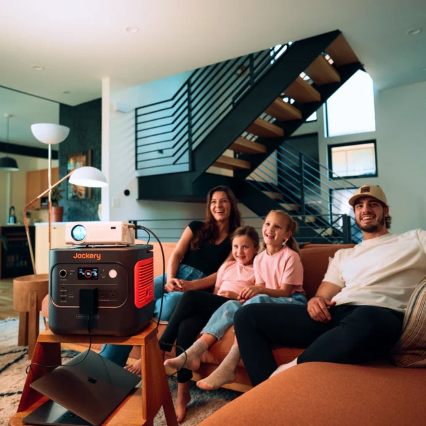 Family watching movies with a projector powered by Jackery Explorer 2000 v2 Portable Power Station