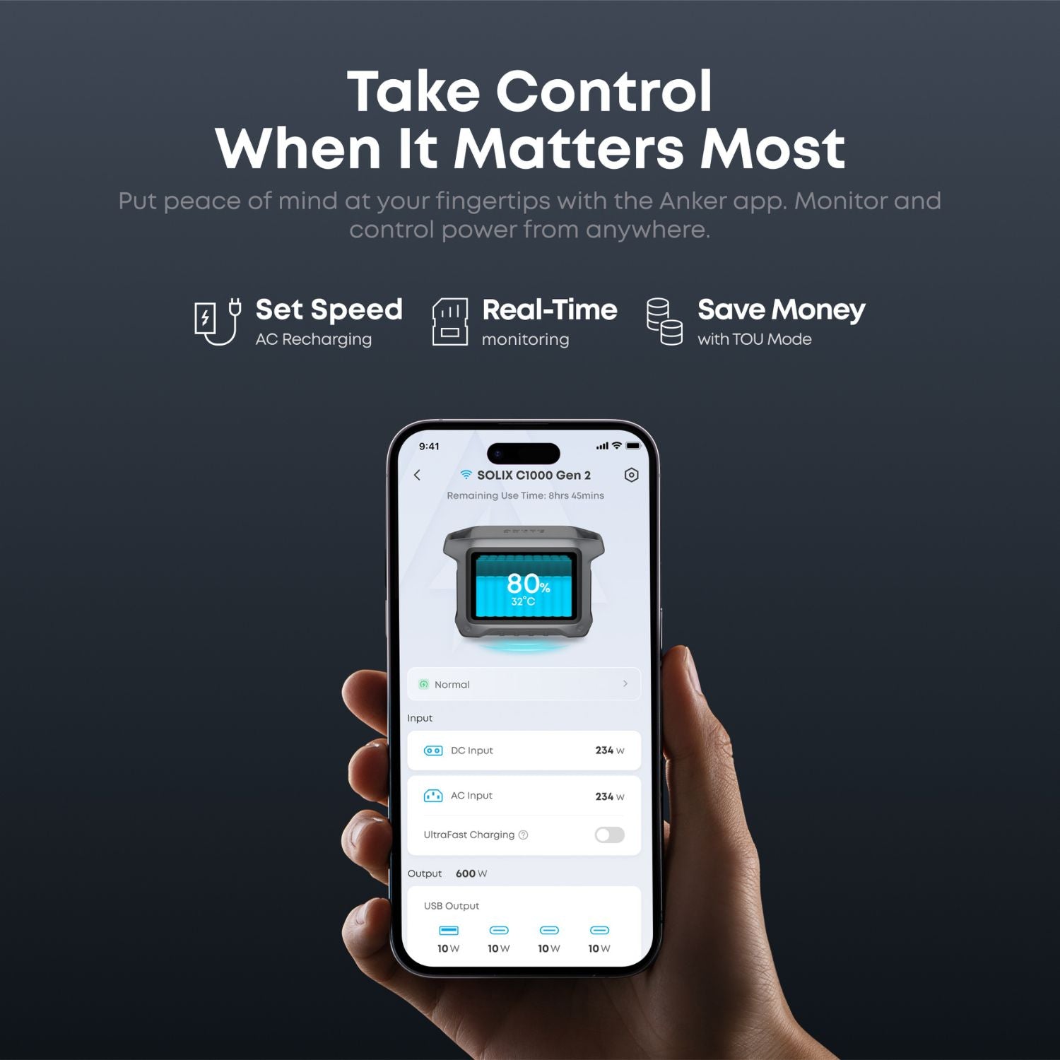 Hand holding a smartphone displaying an app interface for Anker SOLIX C1000 Gen 2 Portable Power Station