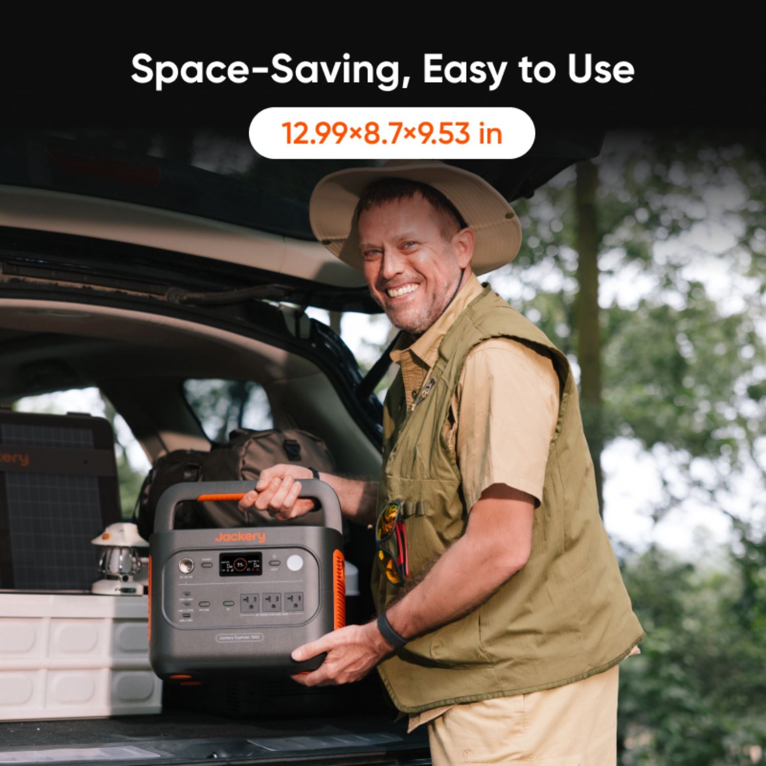 Man holding a Jackery Explorer 1500 v2 Portable Power Station with text indicating space-saving and ease of use, set against a natural outdoor background.