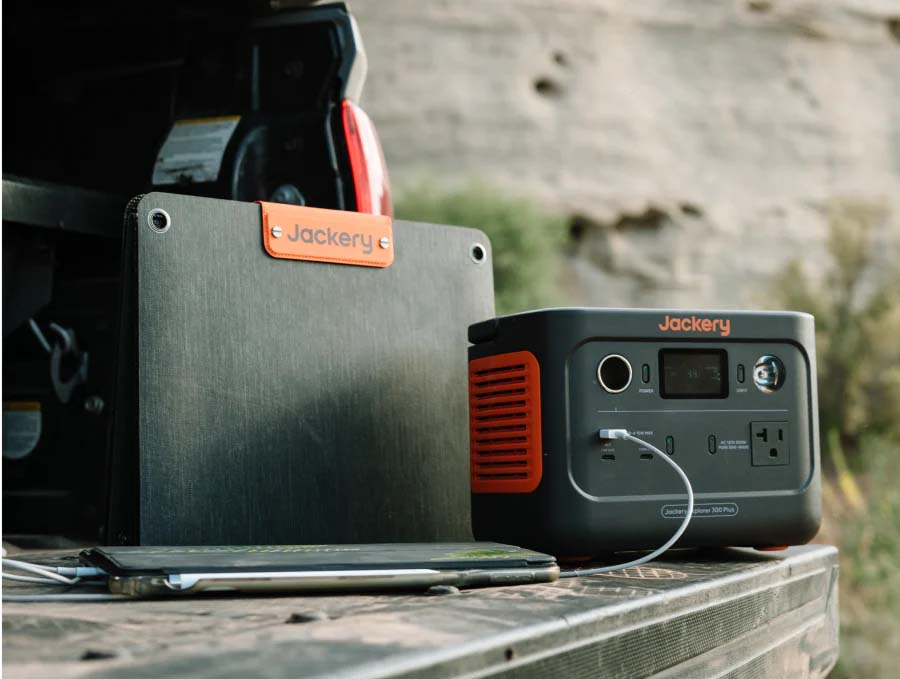 Jackery Explorer 300 Plus On The Bed Of A Truck Charging A Laptop